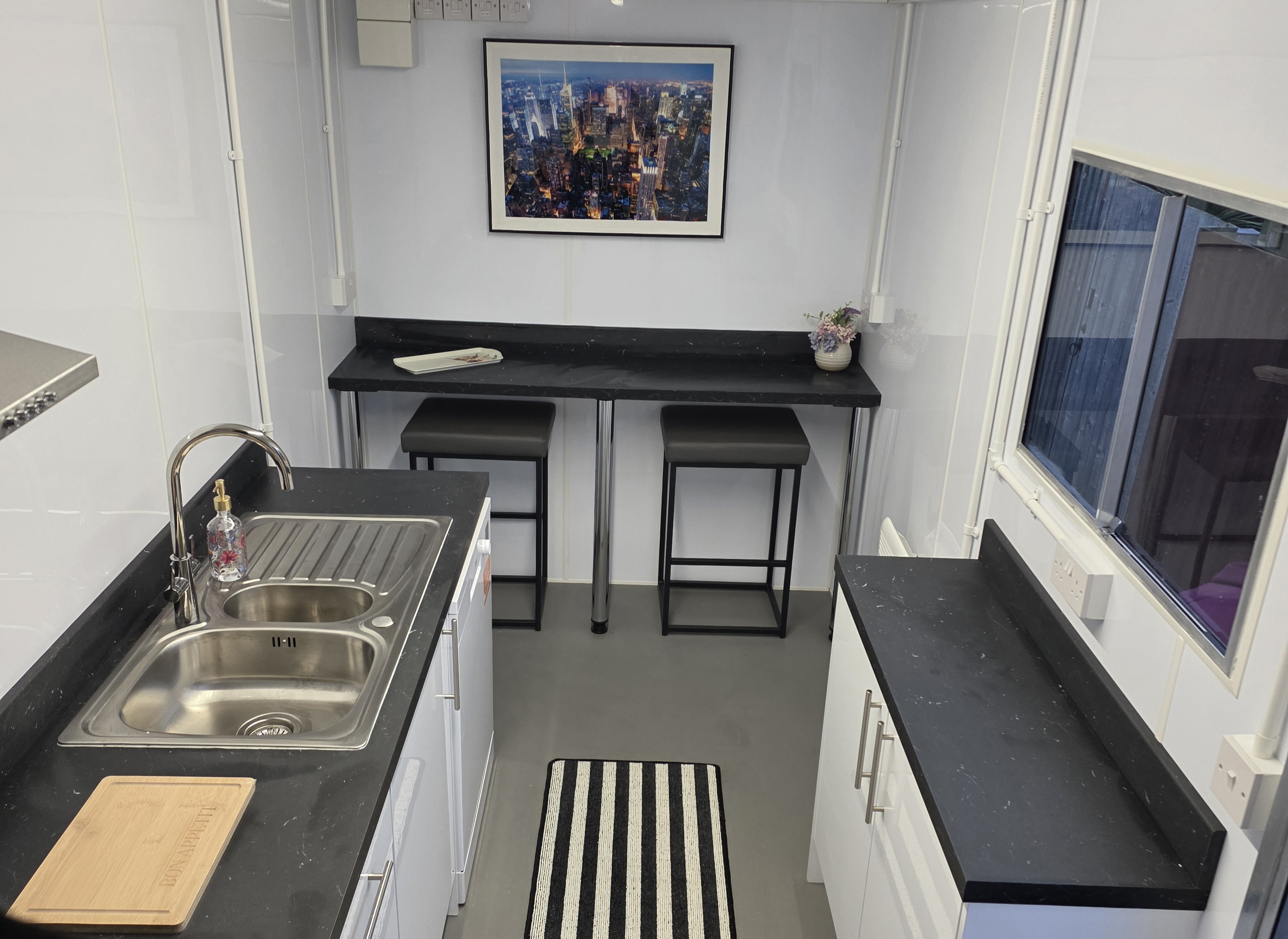 Kitchen pod interior — full counter and sink setup