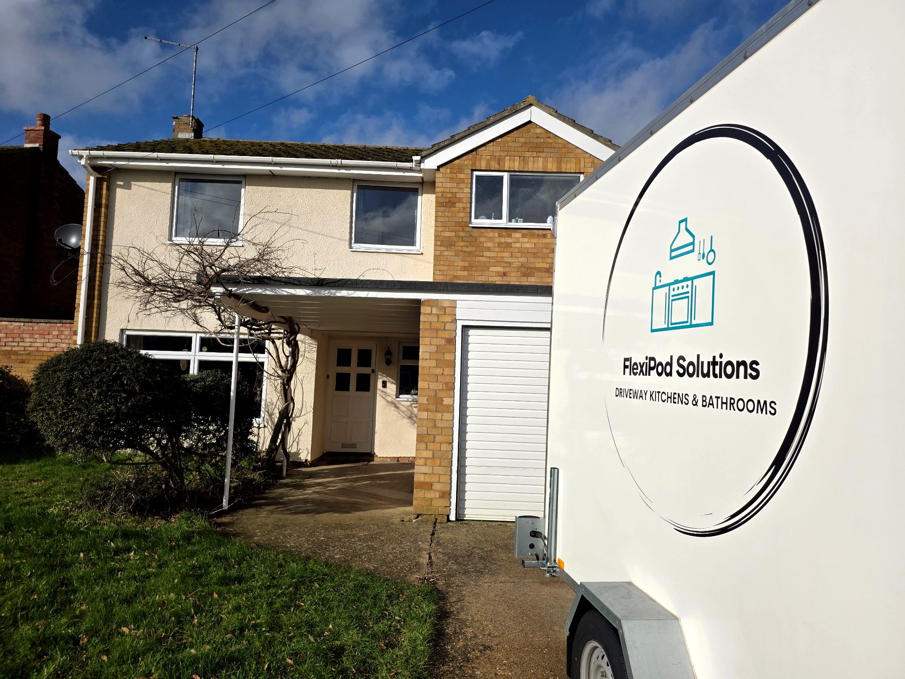 Temporary kitchen pod on driveway during home renovation